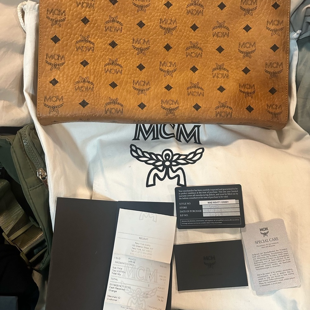 MCM Brown and Black Clutch with Iconic Monogram Design